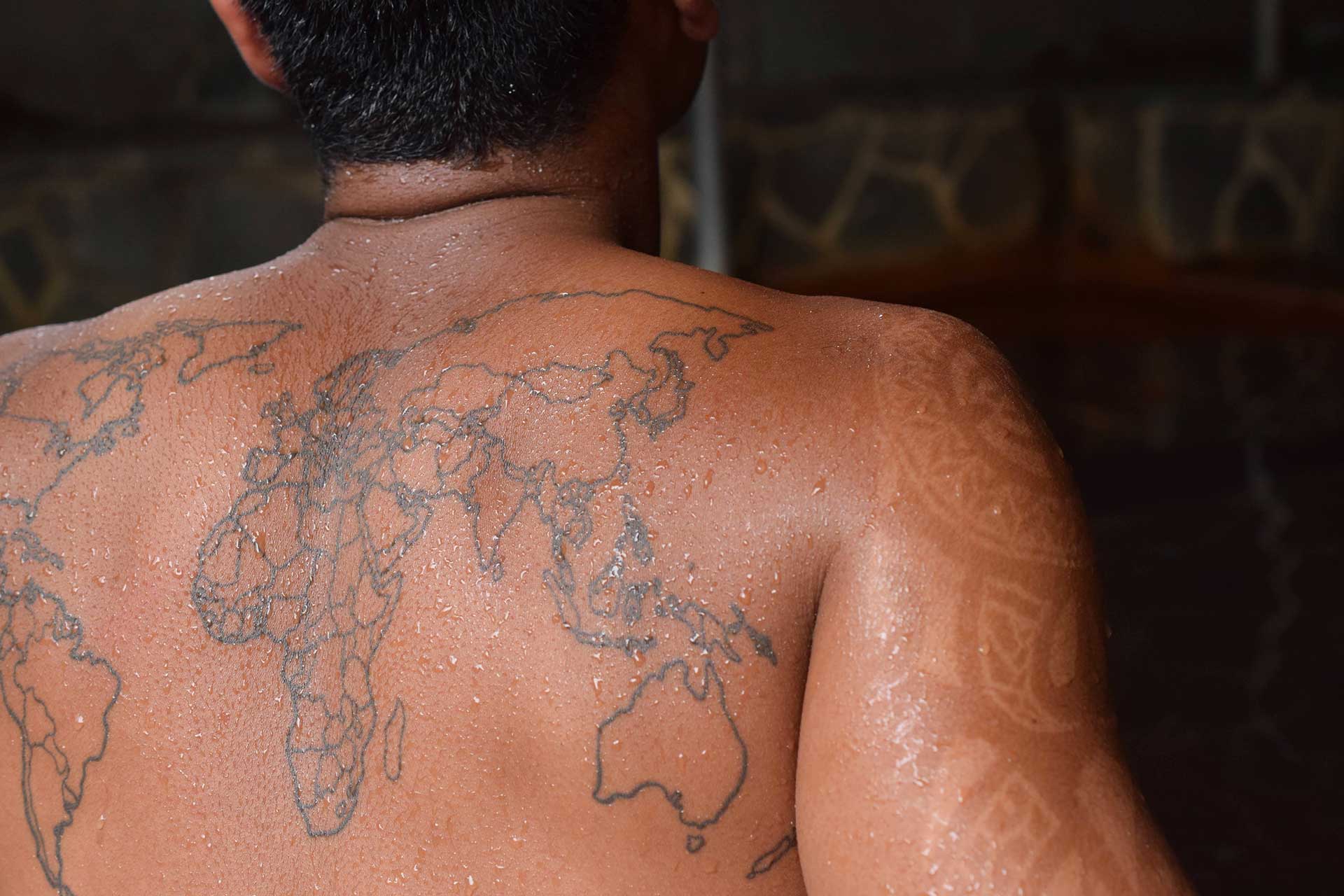 man with tattoo at Beppu Japanese hot spring in tattoo friendly onsen