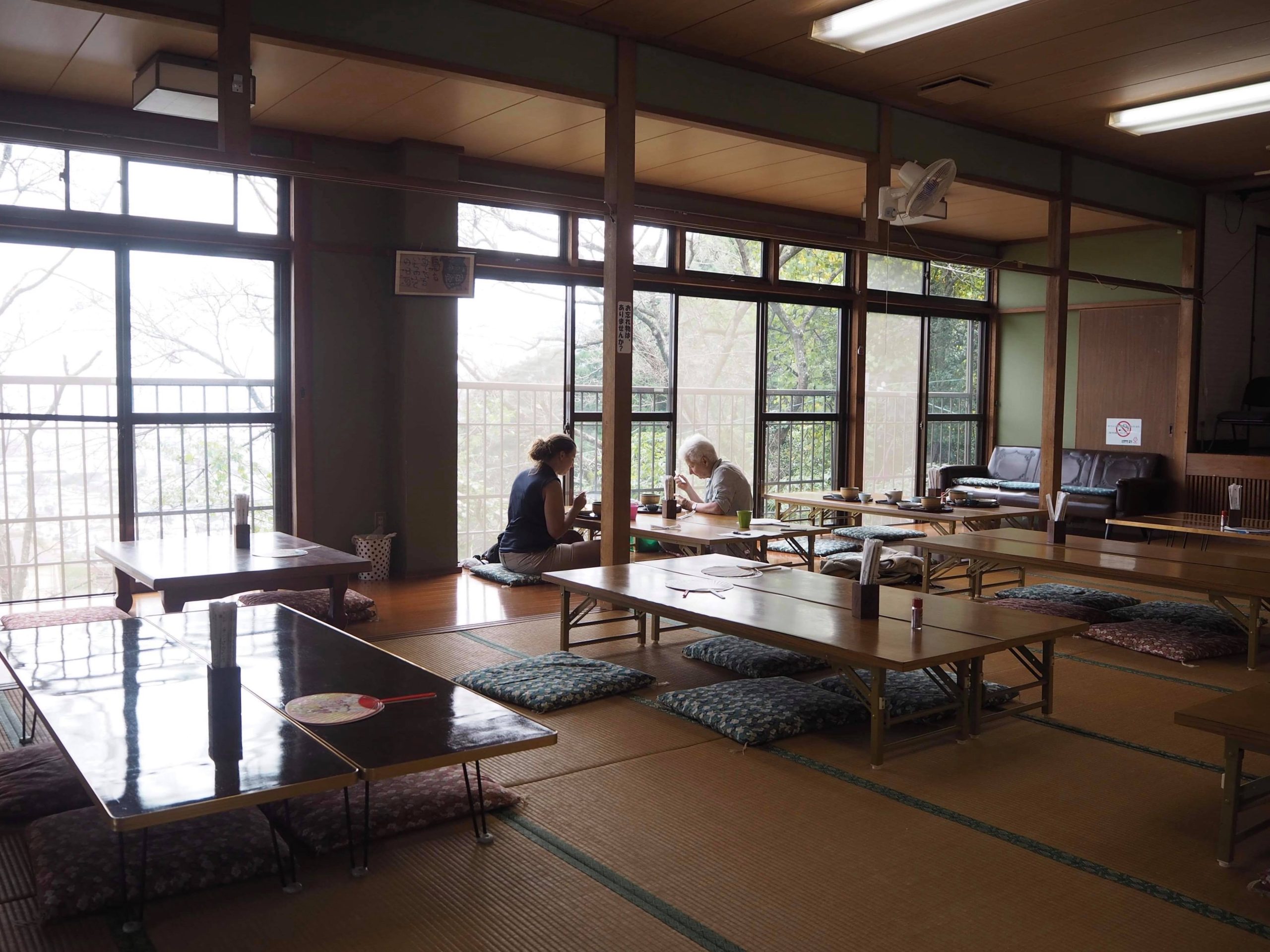 foreigners enjoying japanese food in tatami room in Beppu